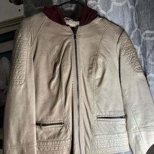 Im selling a cream leather jacket.It has a red hoodie in the back.